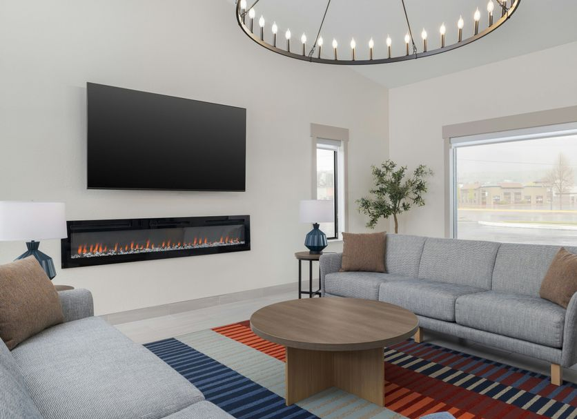 Welcoming hotel lounge seating area with fireplace and chandelier