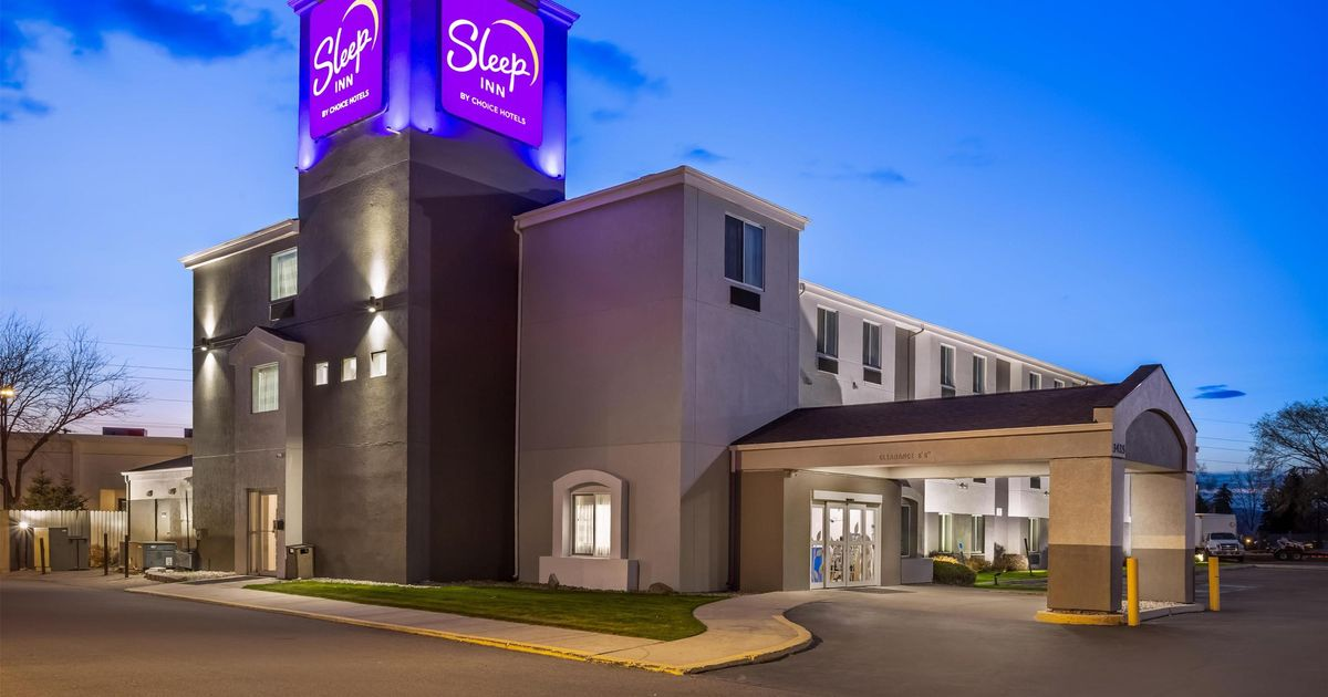 Sleep Inn by Choice Hotels exterior at dusk in Missoula, Montana