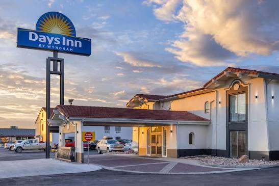 Days Inn by Wyndham hotel exterior at sunset in Casper, Wyoming